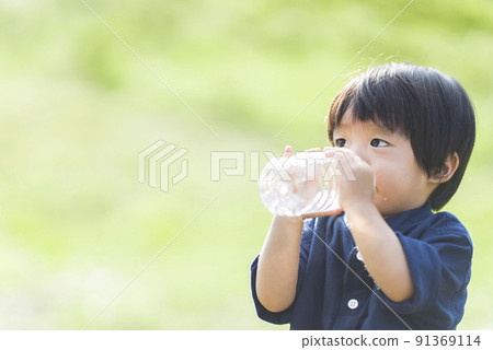 A one and a half year old boy hydrating A one and a half year old boy hydrating 91369114