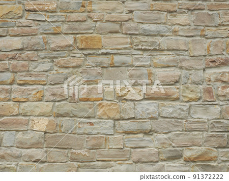 Facade wall with masonry of not the same rectangular bricks. Full-screen image. Not seamless texture 91372222