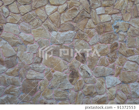 Wall with beige randomly laid out stonework. Non-seamless texture. Full screen photo Wall with beige randomly laid out stonework. Non-seamless texture. Full screen photo 91372553