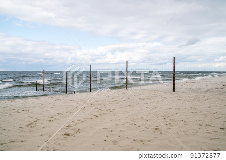 Fence of Polish - Russian border on Balic seashore. 91372877