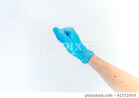 Fist hand in medical glove on white background. 91372959