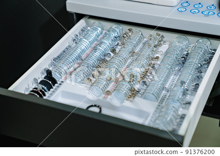 box with a set of test spectacle lenses for the examination. ophthalmologist 91376200