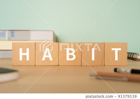 Image of customs | Desk with a block labeled "HABIT" 91379139