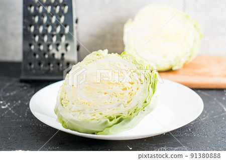 Nearby is grater and cabbage. Nearby is grater and cabbage. 91380888
