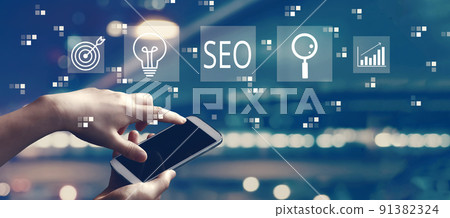 SEO concept with person using smartphone SEO concept with person using smartphone 91382324