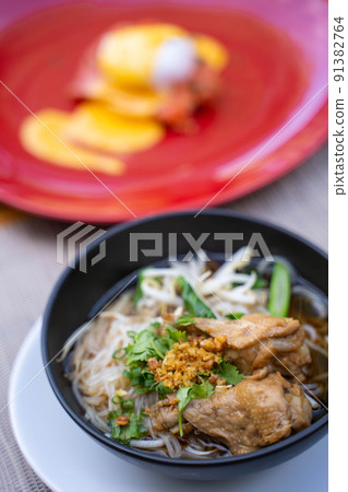 rice noodles in black soup serve with chicken rice noodles in black soup serve with chicken 91382764