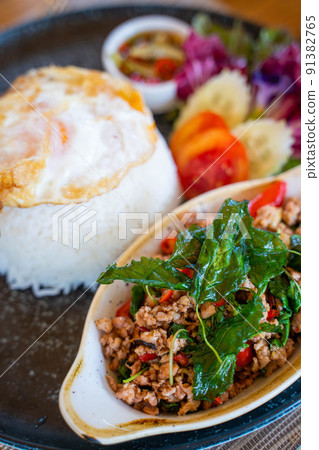 stir fried minced pork with basil serve with rice and eggs stir fried minced pork with basil serve with rice and eggs 91382765