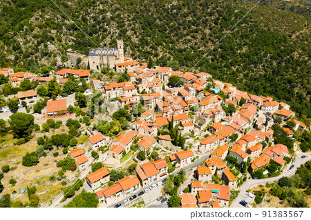 Summer view of French village of Eus with medieval church Summer view of French village of Eus with medieval church 91383567