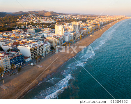 Panoramic aerial view of coast line at Calafell with view of blocks of flats 91384562