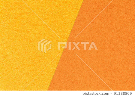 Texture of craft yellow and orange paper background, half two colors, macro. Structure of vintage dense craft cardboard. 91388869