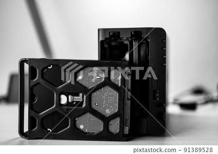 network attached storage NAS with a single bay pulled setup at a home office and remote work redundancy 91389528