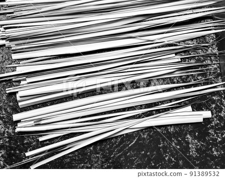 Palm frond leaves laid out on a table during Christian Sunday service. 91389532