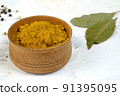 Spices ground curry or turmeric in wooden spice jar, for preparation savory tasty food.. 91395095