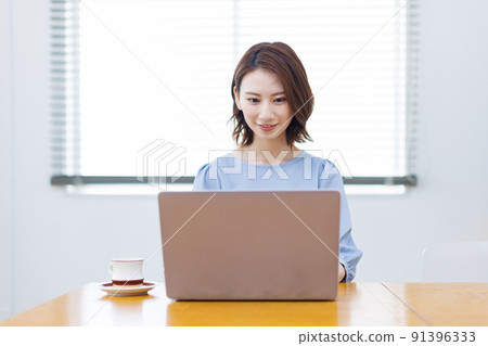 A woman working from home A woman working from home 91396333