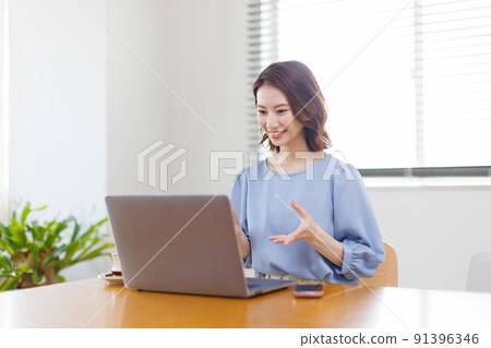 A woman working from home A woman working from home 91396346