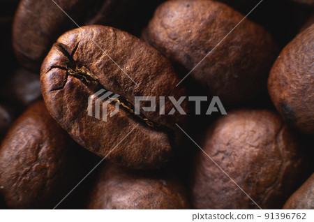 Close-up Coffee roasted beans. Extreme macro coffee background 91396762