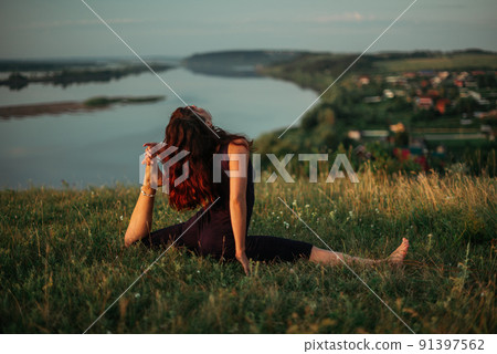 Yoga practice and meditation outdoor. Girl in the park 91397562