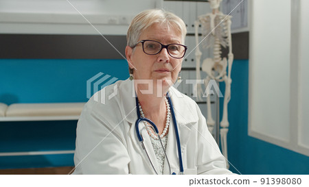 Portrait of female health specialist working with laptop to plan patient appointment in medical office. General practitioner using medication notes to help with diagnosis and treatment. Portrait of female health specialist working with laptop to plan patient appointment in medical office. General practitioner using medication notes to help with diagnosis and treatment. 91398080
