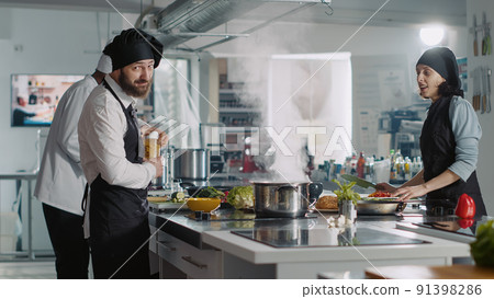 POV of male chef recording cooking show on television program, using camera to film gastronomy video for culinary content. Vlogging delicious meal preparations on professional cuisine TV. POV of male chef recording cooking show on television program, using camera to film gastronomy video for culinary content. Vlogging delicious meal preparations on professional cuisine TV. 91398286