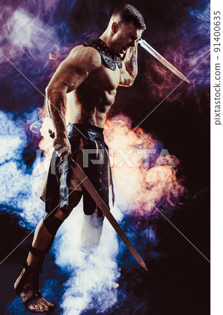Antique warrior with sword against background with smoke Antique warrior with sword against background with smoke 91400635