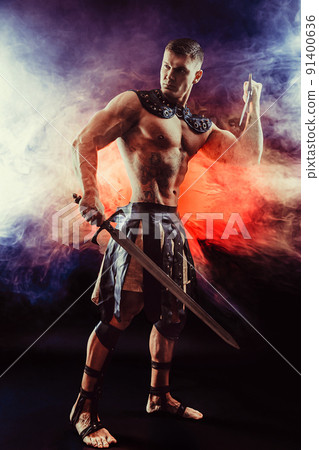 Antique warrior with sword against background with smoke Antique warrior with sword against background with smoke 91400636