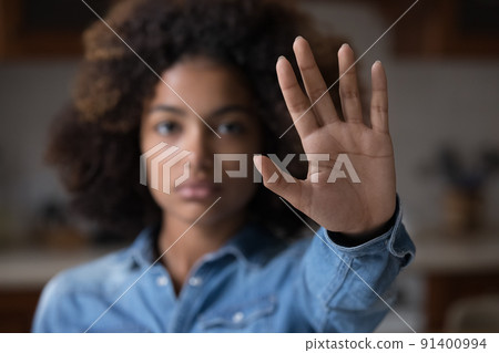 Close up African woman outstretched hand, makes stop gesture 91400994