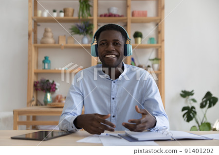 African businessman in headphones provide professional online counselling by videocall African businessman in headphones provide professional online counselling by videocall 91401202