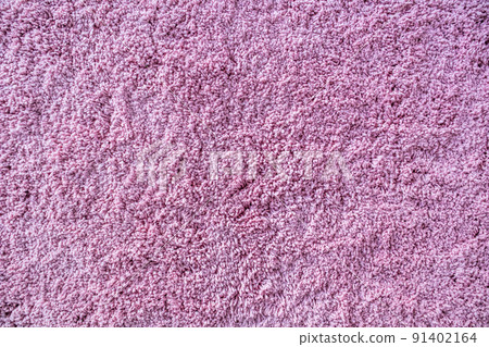Long pile carpet texture. Abstract background of shaggy pink fibers 91402164