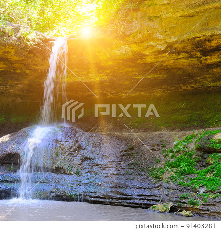 Beautiful waterfall in the forest and sun. Vacation travel holiday banner 91403281