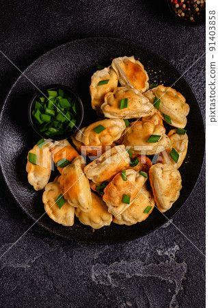 Dumplings, filled with mashed potatoes. 91403858