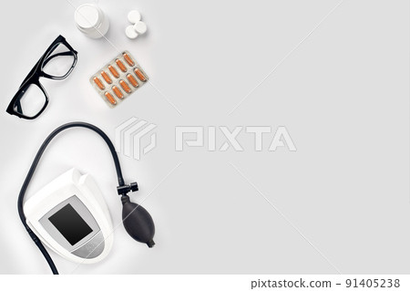 Electronic medical tonometer for measuring blood pressure on a white table 91405238