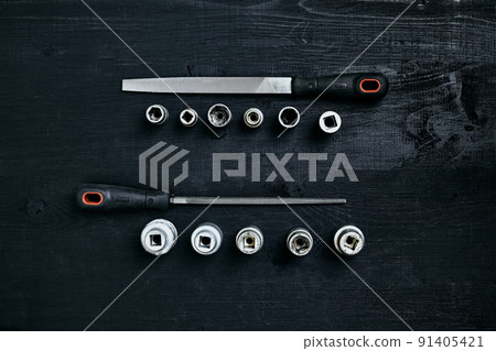 Set of tools chisel, wrenches on black wooden background Set of tools chisel, wrenches on black wooden background 91405421