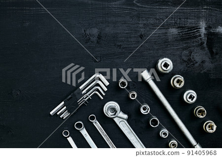 Tools for work or repair auto on black wooden background. Top view 91405968