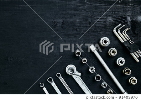 Tools for work or repair auto on black wooden background. Top view Tools for work or repair auto on black wooden background. Top view 91405970