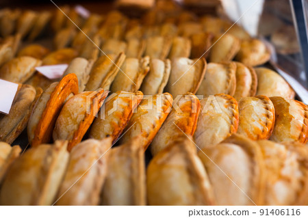 freshly baked empanadas with different fillings for sale freshly baked empanadas with different fillings for sale 91406116