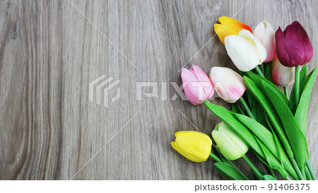 tulip flowers bouquet with space copy on wooden background 91406375