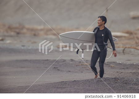 Surfer rising from the sea Surfer rising from the sea 91406918