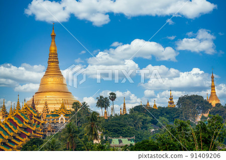 Shwedagon Pagoda attraction in Yagon City with blue sky background, Shwedagon Pagoda ancient architecture is beautiful pagoda in Southeast Asia, Yangon, Myanmar, Asian, Asia. Shwedagon Pagoda attraction in Yagon City with blue sky background, Shwedagon Pagoda ancient architecture is beautiful pagoda in Southeast Asia, Yangon, Myanmar, Asian, Asia. 91409206