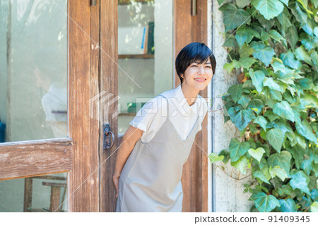 A young woman relaxing on the terrace A young woman relaxing on the terrace 91409345