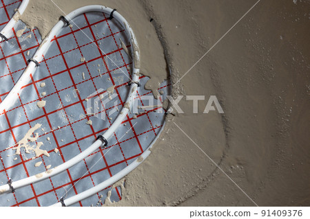 Floor plumber heating system, underfloor plumber heating concept, a building concept Floor plumber heating system, underfloor plumber heating concept, a building concept 91409376