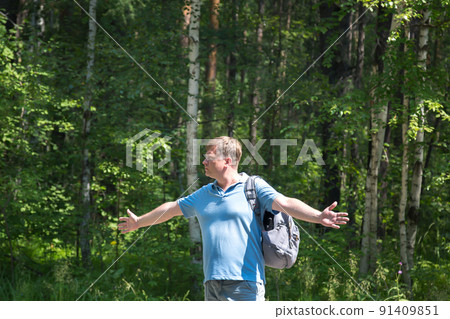 Male tourist auto stop spread his arms to the sides on an empty road Male tourist auto stop spread his arms to the sides on an empty road 91409851