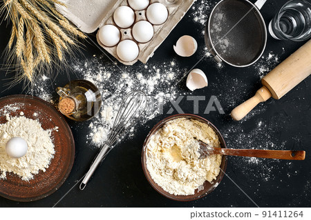 Pasta cooking ingredients on black kitchen table. Top view with space for your text Pasta cooking ingredients on black kitchen table. Top view with space for your text 91411264