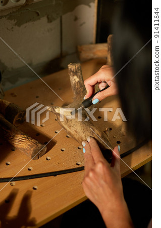 Female using power wood working tools graver, carving while crafting 91411844