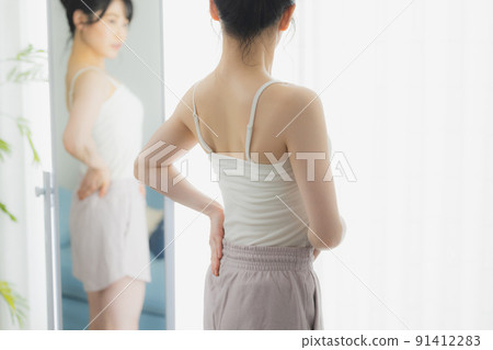 A woman looking at her 91412283