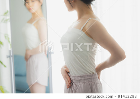 A woman looking at her 91412288