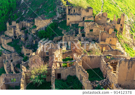 top view of the ruins of the buildings of the uninhabited village of Gamsutl in Dagestan 91412378
