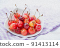 Cherry served on a white plate 91413114