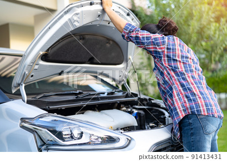 Open hood mechanic engine system to check and repair damage car crash. Open hood mechanic engine system to check and repair damage car crash. 91413431