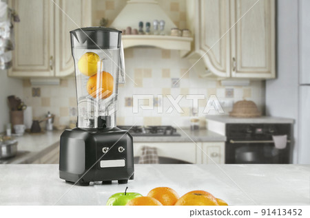 Orange juice blender machine in the kitchen interior 91413452