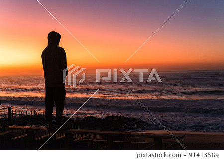 Beach Man Silhouetted Ocean Morning Sky Colors 91413589